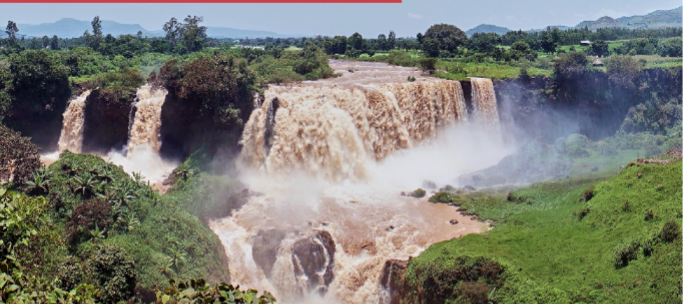 The Nile River flowing through a lush landscape, symbolizing the central resource in the Ethiopia-Egypt dispute.